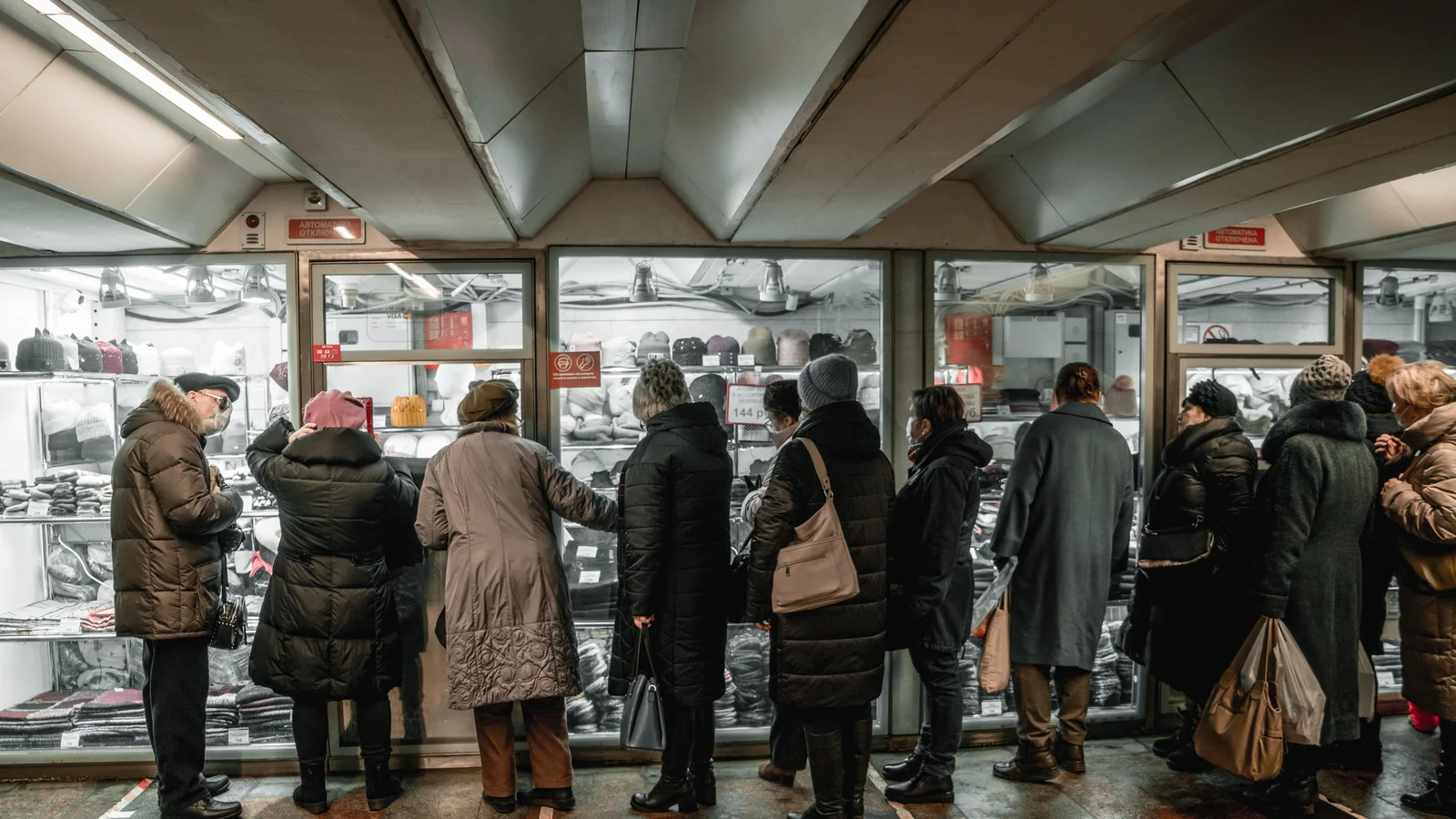 People lining up in a queue to buy something