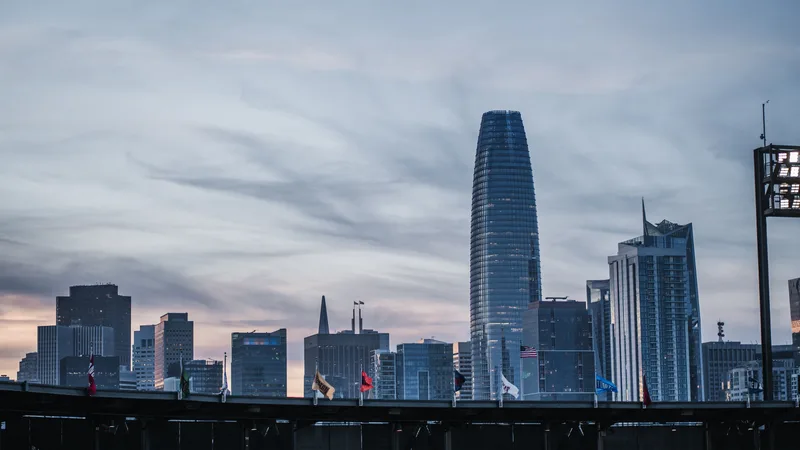 Captivating view of San Francisco skyline at dusk featuring modern skyscrapers against a colorful sky.
